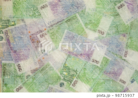 Blurred photo of one hundred and five hundred euros are defrosted in ice. The European cash currency is frozen. Blurred photo of one hundred and five hundred euros are defrosted in ice. The European cash currency is frozen. 98715937
