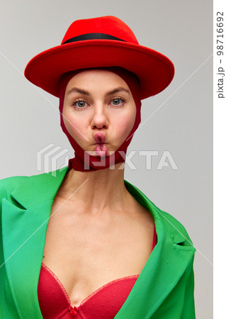 Studio Shot Of Emotive Young Stylish Girl Wearing Winter Coat And