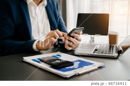 Businessman using on smartphone and tablet at home as concept 98716911