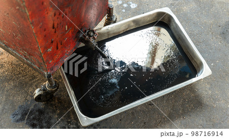 Old oil tray that was removed from the automobile. Old oil tray that was removed from the automobile. 98716914