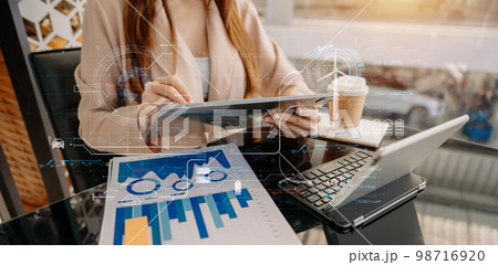 Business working with reduce CO2 concept with icons, global warming such as reforest green factory recycle and zero carbon dioxide emission concept. with VR icon at office. Business working with reduce CO2 concept with icons, global warming such as reforest green factory recycle and zero carbon dioxide emission concept. with VR icon at office. 98716920