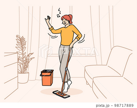 Happy woman listen to music cleaning home Happy woman listen to music cleaning home 98717889