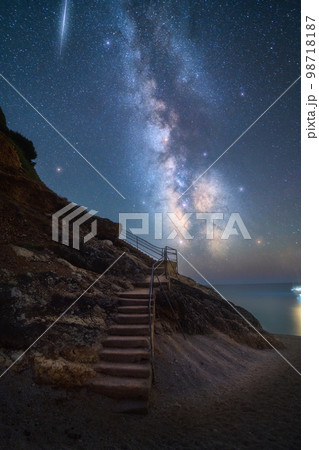 Milky Way and stairs on the beach at summer starry night 98718187