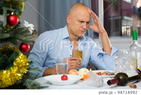Upset man at the New Year table 98718992