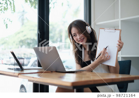 I have a question. Business woman show the question while online conference by laptop. Business and Entrepreneurship event 98721164