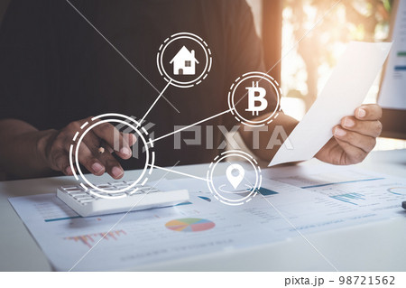American african man is managing, calculating the debt and holding cost bill with virtual icon on screen. American african man is managing, calculating the debt and holding cost bill with virtual icon on screen. 98721562