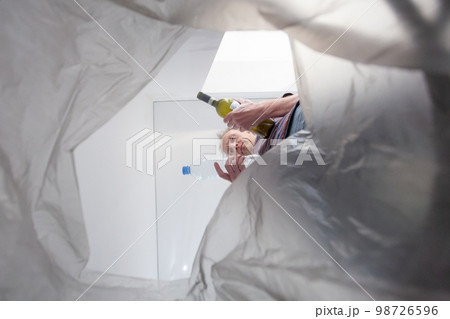 Recycle bin concept. Man throwing garbage in a trash bin Recycle bin concept. Man throwing garbage in a trash bin 98726596