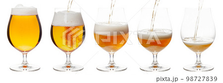 Pouring beer in tulip glass isolated on white Pouring beer in tulip glass isolated on white 98727839