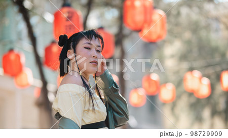 Portrait of an Asian woman against the background of Chinese lanterns.  98729909