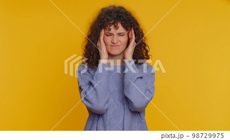 Woman rubbing temples to cure headache problem, suffering from tension and migaine, stress, pain Woman rubbing temples to cure headache problem, suffering from tension and migaine, stress, pain 98729975