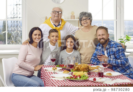 Portrait of happy family of three generations who celebrate Thanksgiving together. 98730280