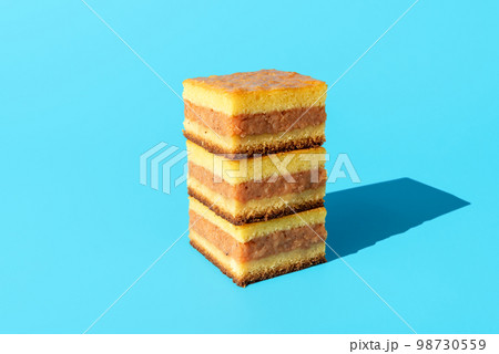 Apple cake slices isolated on a blue background 98730559
