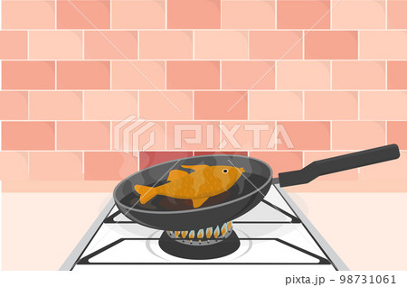big goldfish salmon trout in a pan fry on a gas stove big goldfish salmon trout in a pan fry on a gas stove 98731061