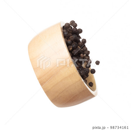 Black Pepper seeds fly throw up in wooden bowl, Black Pepper float explode, abstract cloud fly. Black Peppercorn splash throwing in Air. White background Isolated high speed shutter, freeze motion 98734161