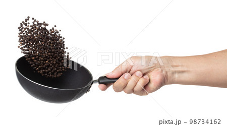 Black Pepper seeds fly throw up in pan, Black Pepper float explode, abstract cloud fly. Black Peppercorn splash throwing in Air. White background Isolated high speed shutter, freeze motion 98734162