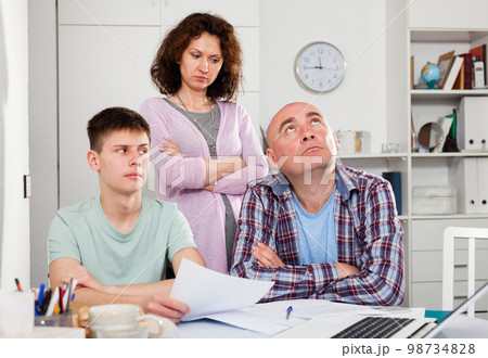 Worried family with papers Worried family with papers 98734828