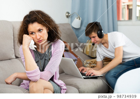 Mother worried son addicted with laptop 98734939