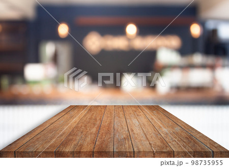 Perspective top wooden with blurred cafe background 98735955