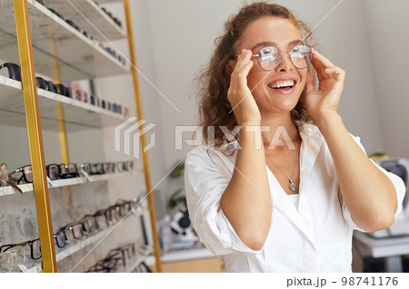 Eyeglasses Store. Woman with Glasses For Eyesight Correction 98741176