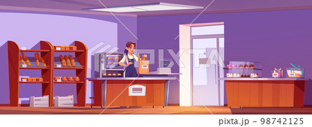 Young saleswoman packing fresh bread in paper bag 98742125