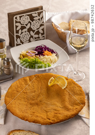 Giant veal viennese schnitzel 98742632