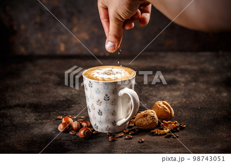 Hazelnut and walnut flavored coffee latte 98743051