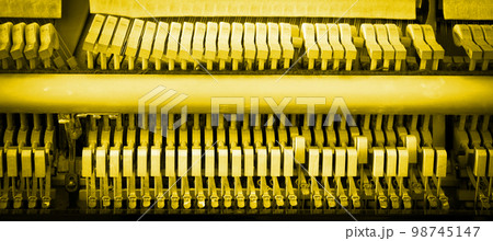 Details of piano mechanism gavel - string, pins and hammers Details of piano mechanism gavel - string, pins and hammers 98745147