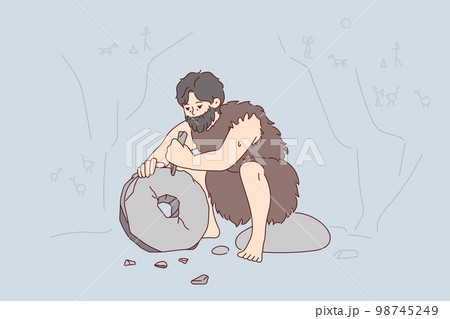 Ancient man with beard who lives in cave uses stone tool to create wheel. Vector image 98745249