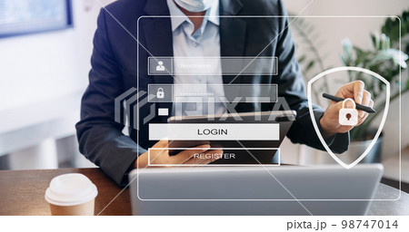 Cyber security concept, Login, User, identification information security and encryption, secure access to user's personal information man using smart phone and tablet in office. 98747014