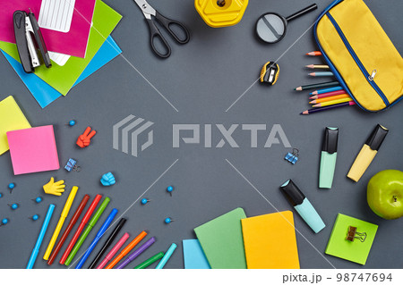 Flat lay photo of workspace desk with school accessories or office supplies. Flat lay photo of workspace desk with school accessories or office supplies. 98747694