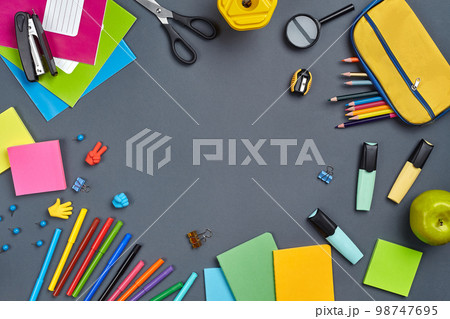 Flat lay photo of workspace desk with school accessories or office supplies. 98747695