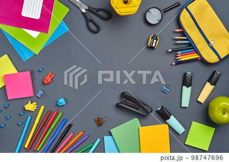 Flat lay photo of workspace desk with school accessories or office supplies. Flat lay photo of workspace desk with school accessories or office supplies. 98747696