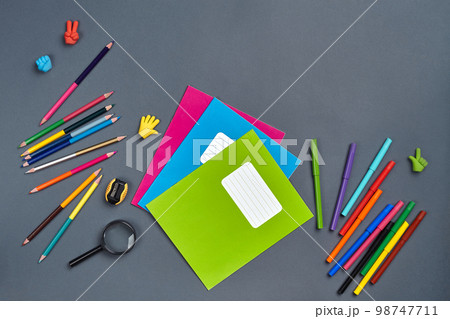 Flat lay photo of workspace desk with school accessories or office supplies. Flat lay photo of workspace desk with school accessories or office supplies. 98747711