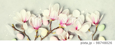 Easter composition with Spring magnolia flowers on grey stone background 98748026