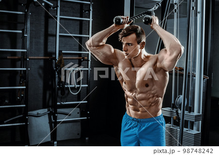 Sexy muscular man posing in gym, shaped abdominal. Strong male naked torso abs, working out Sexy muscular man posing in gym, shaped abdominal. Strong male naked torso abs, working out 98748242