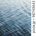 Water surface with ripples 98749043