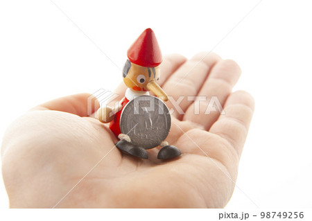 image of wooden toy coin hand white background image of wooden toy coin hand white background 98749256