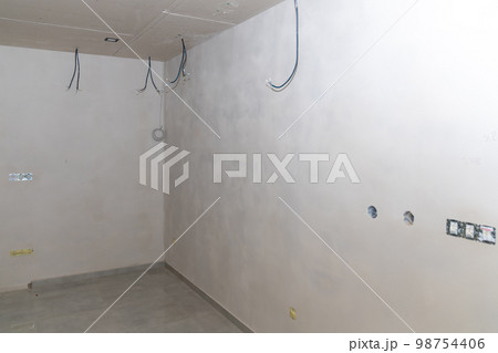 electrical installation in a room on the construction site electrical installation in a room on the construction site 98754406