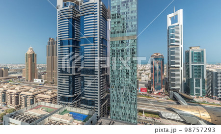 Panorama showing aerial view of Dubai International Financial District with many skyscrapers . 98757293
