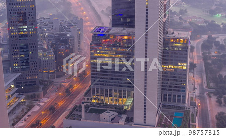 Office skyscrapers in financial district aerial night to day 98757315