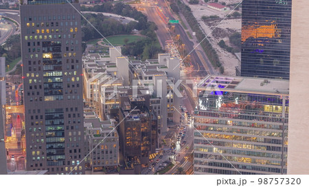 Office skyscrapers in financial district aerial day to night 98757320