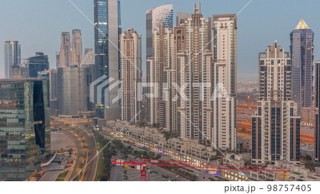 Bay Avenue with modern towers residential development in Business Bay aerial night to day , Dubai Bay Avenue with modern towers residential development in Business Bay aerial night to day , Dubai 98757405