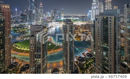 Panorama showing Dubai Downtown cityscape with tallest skyscrapers around aerial night . 98757409