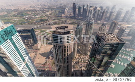 Fog covered skyscrapers in JLT district aerial . Fog covered skyscrapers in JLT district aerial . 98757766