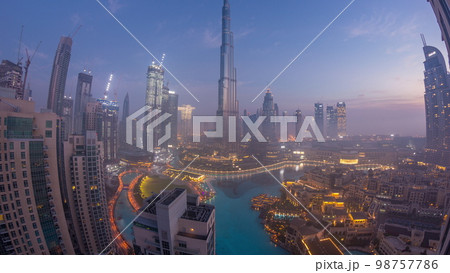 Aerial view of Dubai city early morning during fog night to day . Aerial view of Dubai city early morning during fog night to day . 98757786