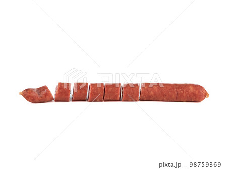 Sliced thin half-smoked sausage on a white background. Sliced thin half-smoked sausage on a white background. 98759369