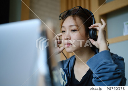 E-learning ,online ,education and internet social distancing protect from COVID-19 viruses concept. Asian woman student video conference e-learning with teacher on digital tablet at home. 98760378