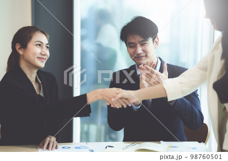Business people successful negotiation and handshake. celebration partnership and teamwork, business deal concept. Business people successful negotiation and handshake. celebration partnership and teamwork, business deal concept. 98760501