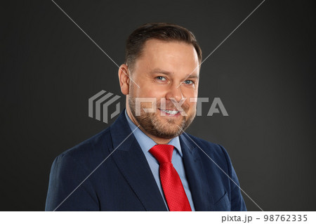 Portrait of happy mature man on black background Portrait of happy mature man on black background 98762335
