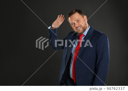 Portrait of emotional mature man on black background Portrait of emotional mature man on black background 98762337